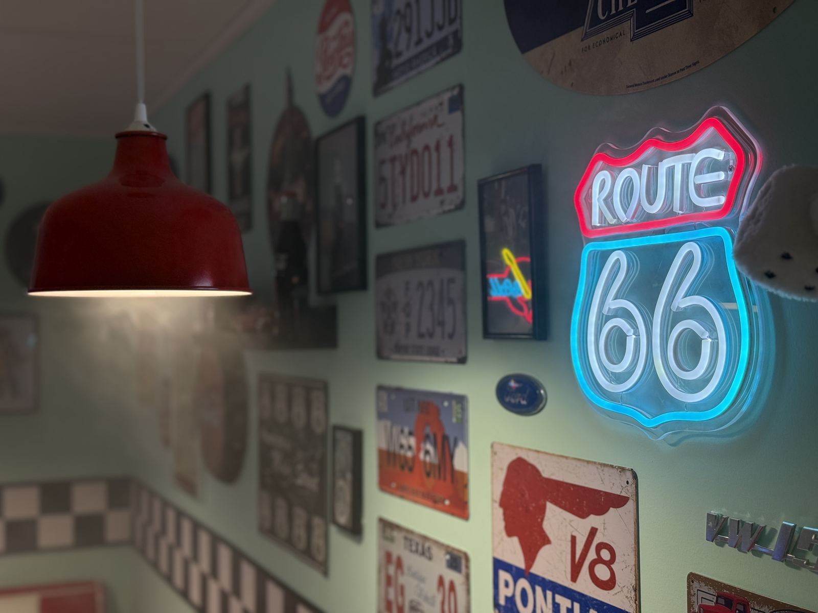 Route 66 neon on the diner memorabilia wall